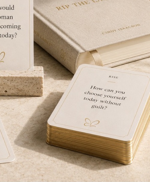 An open Rip the Labels journal with a gold pen